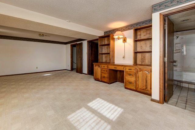 interior space with vanity and a textured ceiling