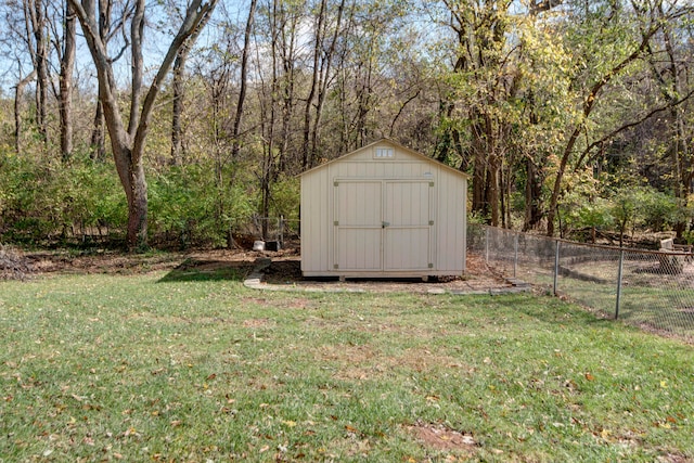 view of outbuilding with a yard