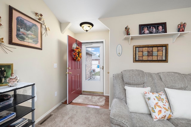 view of carpeted foyer