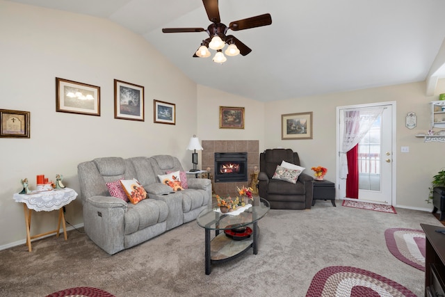 carpeted living room with a fireplace, ceiling fan, and lofted ceiling