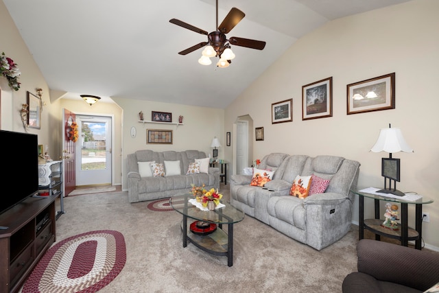 carpeted living room featuring ceiling fan and vaulted ceiling