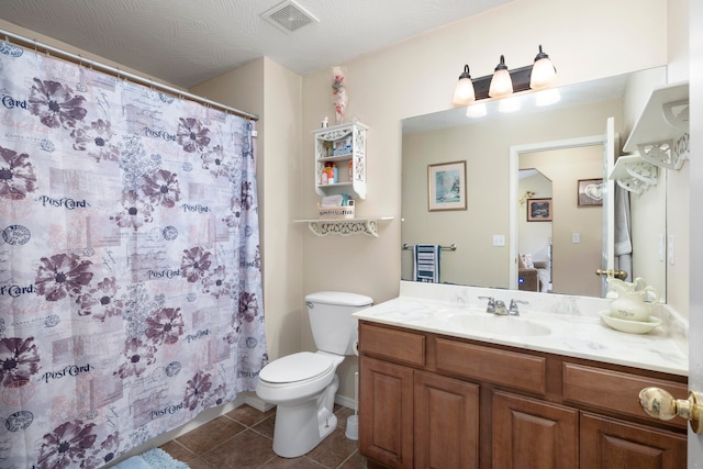 bathroom with toilet, tile patterned floors, a textured ceiling, vanity, and a shower with shower curtain