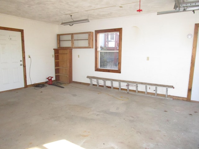 27038 Hickory Dr, Eagle Rock, MO 65641 - garage featuring baseboards