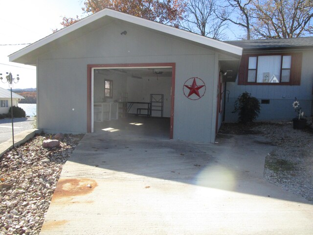 27038 Hickory Dr, Eagle Rock, MO 65641 - garage featuring concrete driveway