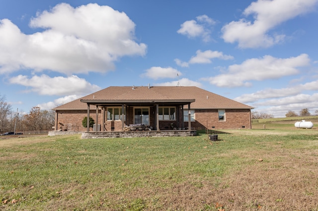 back of property with a yard