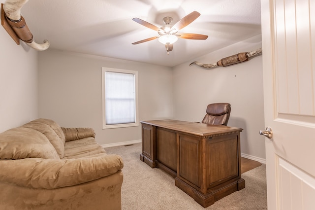 carpeted office with ceiling fan
