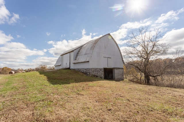 view of outdoor structure with a lawn