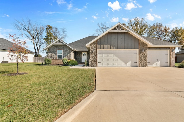 view of front of house featuring a garage and a front yard