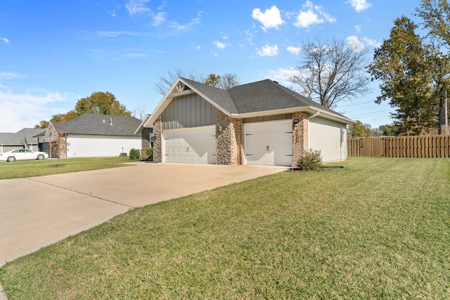 view of front of property featuring a garage and a front lawn