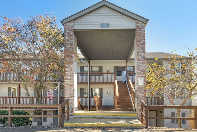 back of house featuring a balcony