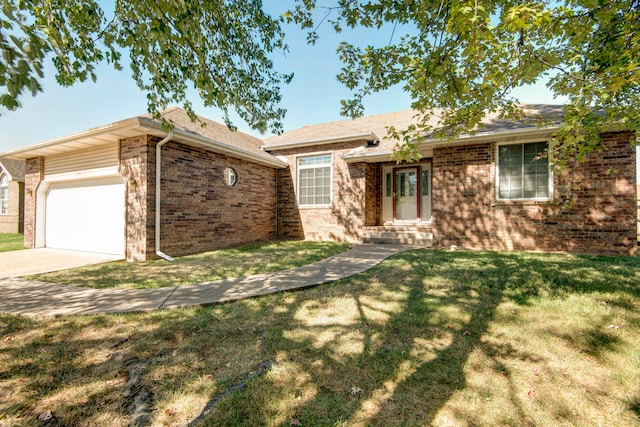 ranch-style house featuring a garage and a front lawn