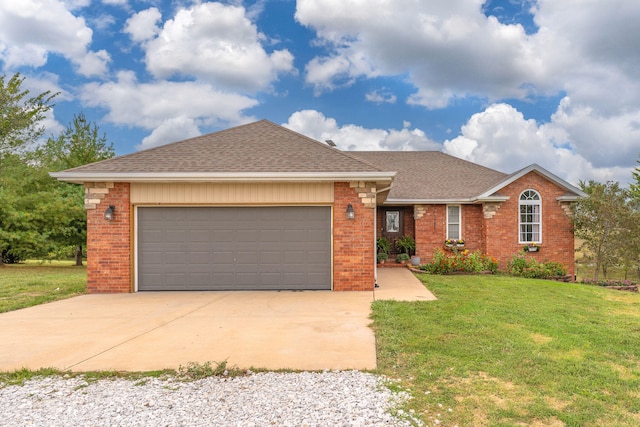 ranch-style house with a garage and a front yard