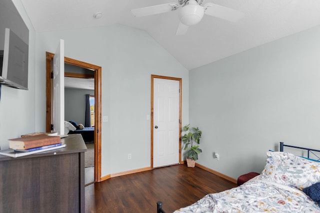 bedroom with vaulted ceiling, ceiling fan, and dark hardwood / wood-style flooring