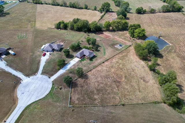 aerial view featuring a water view and a rural view