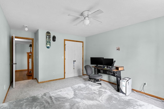 office area featuring ceiling fan and light colored carpet