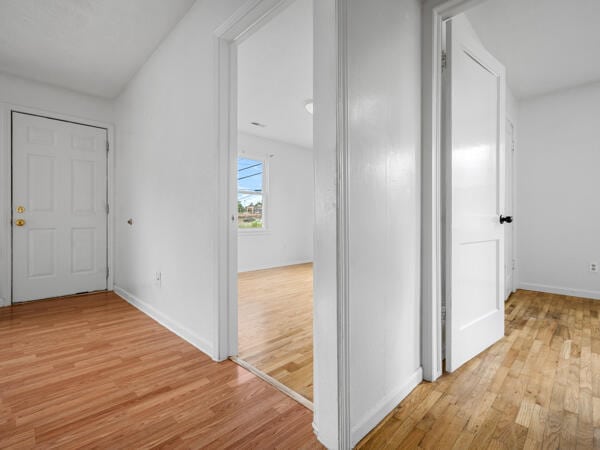 603 E Maupin St, Bolivar, MO 65613 - hall featuring light wood-style floors and baseboards