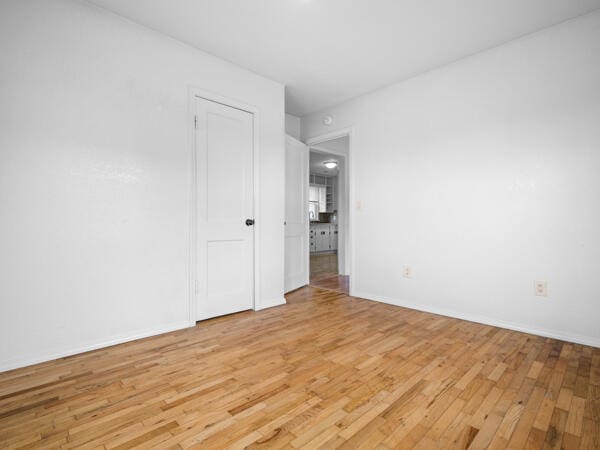 603 E Maupin St, Bolivar, MO 65613 - spare room featuring light wood finished floors and baseboards