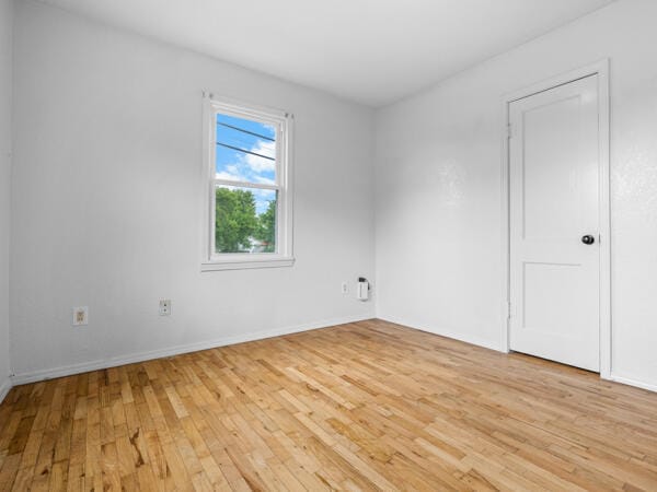 603 E Maupin St, Bolivar, MO 65613 - spare room featuring light wood-type flooring and baseboards