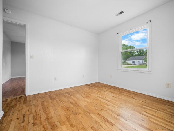 603 E Maupin St, Bolivar, MO 65613 - empty room featuring light wood-style floors and baseboards