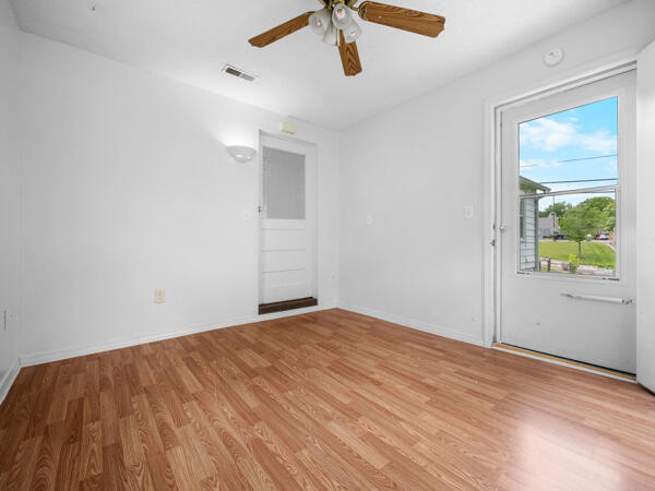 603 E Maupin St, Bolivar, MO 65613 - empty room featuring light wood-type flooring, ceiling fan, and baseboards