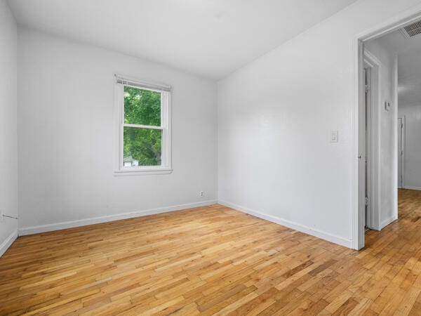 603 E Maupin St, Bolivar, MO 65613 - empty room featuring light wood finished floors and baseboards