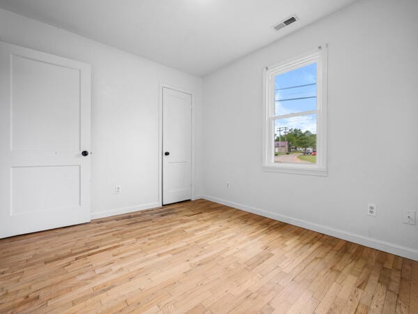 603 E Maupin St, Bolivar, MO 65613 - unfurnished bedroom featuring light wood-style floors and baseboards
