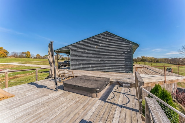 wooden terrace with a rural view and a covered hot tub