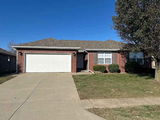 ranch-style home featuring a garage and a front lawn