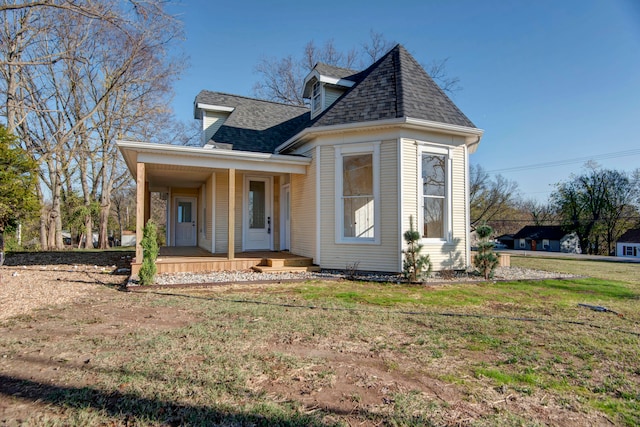 view of front of home featuring a front lawn and a porch