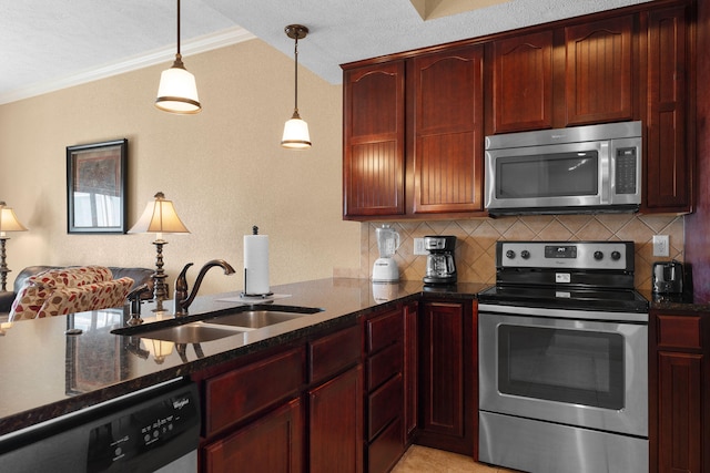 kitchen featuring tasteful backsplash, crown molding, stainless steel appliances, pendant lighting, and sink