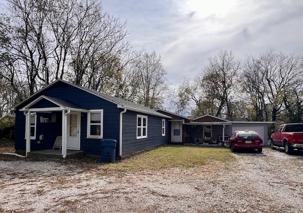 view of front of home featuring a garage and a porch