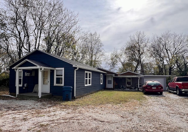 view of front of home featuring a garage and a porch