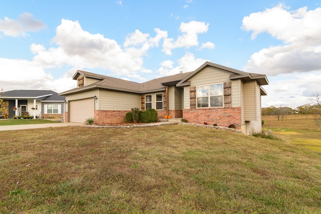 view of front of home featuring a front lawn and a garage