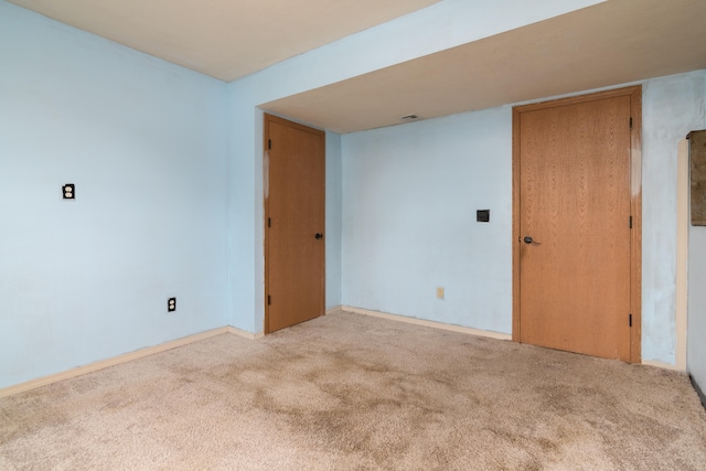 spare room with light carpet