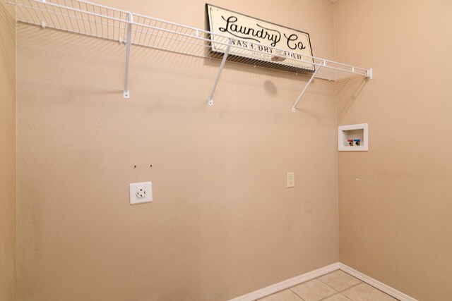 laundry room with hookup for an electric dryer, tile patterned flooring, and hookup for a washing machine