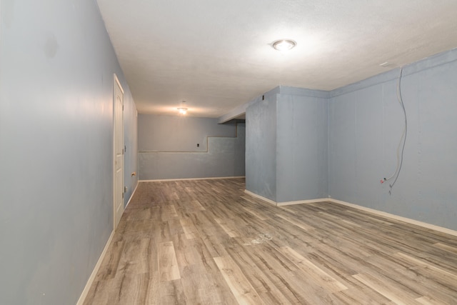 basement with light wood-type flooring