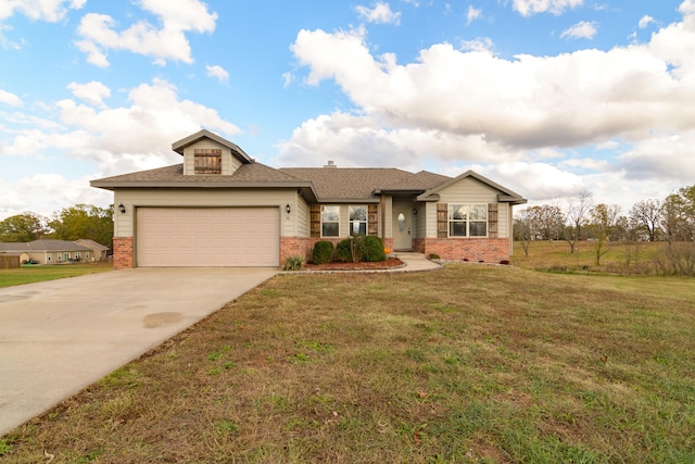 view of front of house with a garage and a front yard