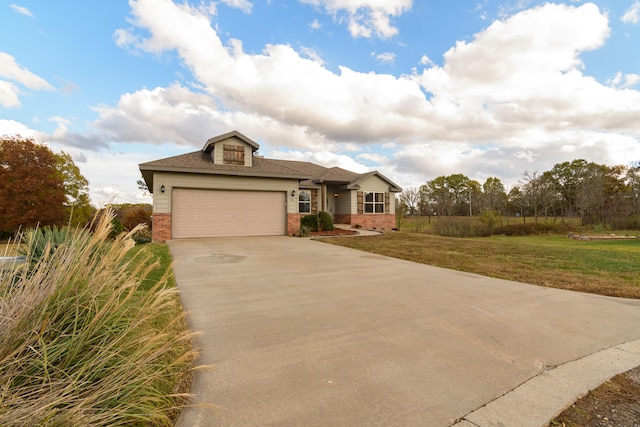 view of front of house featuring a garage and a front lawn