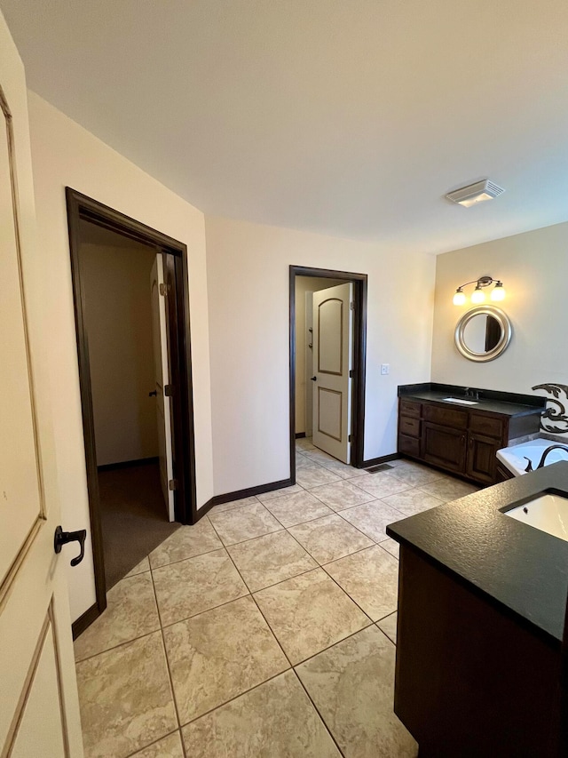 bathroom with tile patterned floors and sink