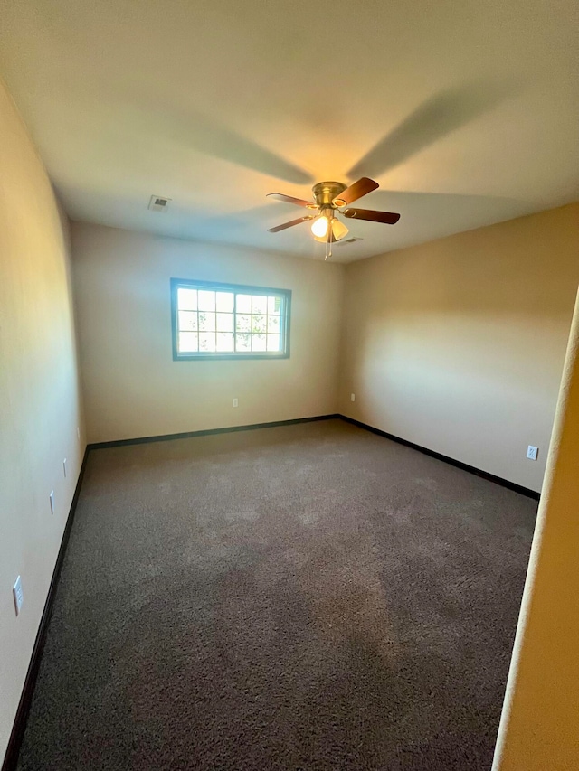 unfurnished room featuring carpet flooring and ceiling fan