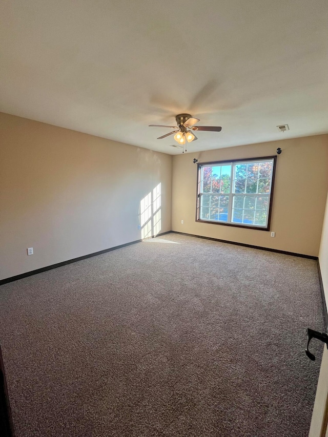 unfurnished room with carpet floors and ceiling fan