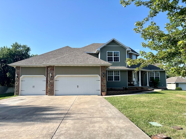 view of front facade with a garage and a front lawn