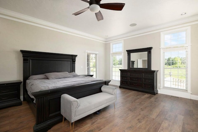 bedroom featuring crown molding, ceiling fan, and dark hardwood / wood-style floors