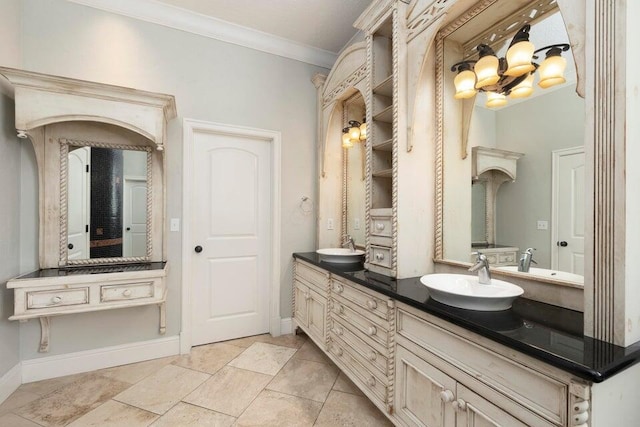 bathroom with ornamental molding and vanity