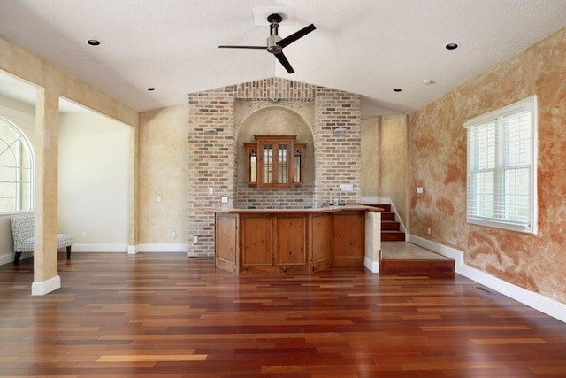 bar with dark hardwood / wood-style flooring, lofted ceiling, and ceiling fan