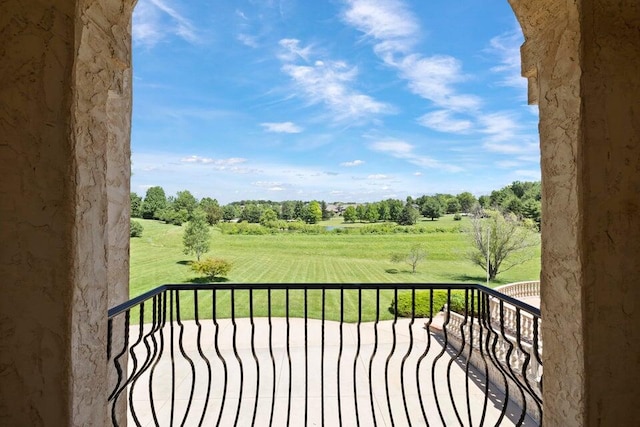 balcony featuring a rural view