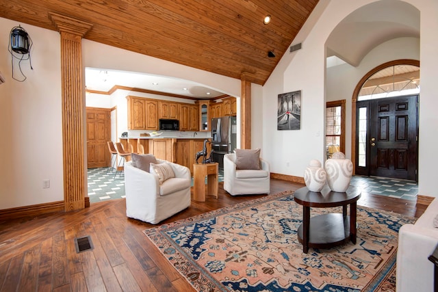 living room featuring high vaulted ceiling, dark wood-type flooring, and wood ceiling