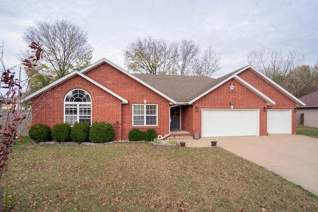 single story home with a garage and a front yard