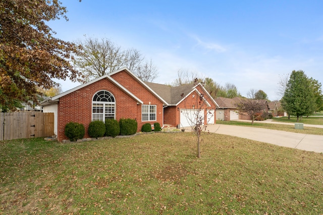 ranch-style house with a garage and a front yard