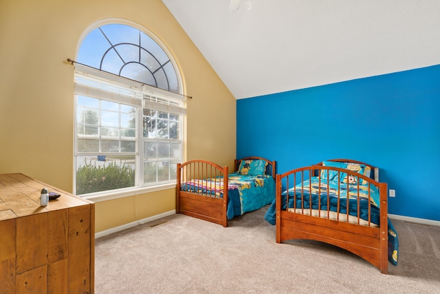 carpeted bedroom featuring lofted ceiling